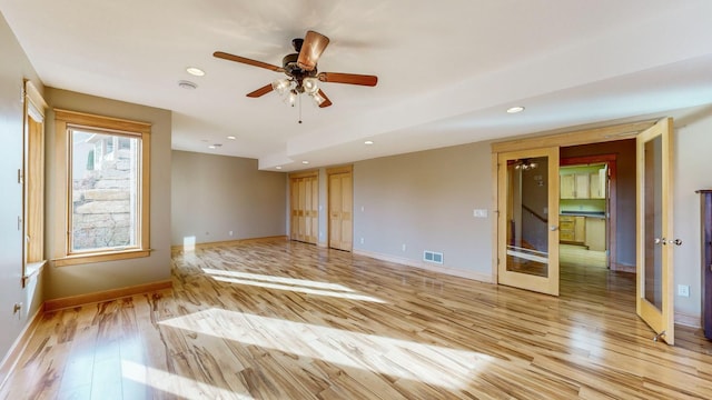unfurnished room with light wood-style flooring, baseboards, recessed lighting, and a ceiling fan