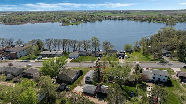 aerial view of residential area featuring a nearby body of water