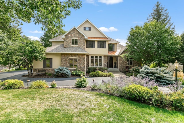2255 Chelmsford Ln, Saint Cloud, MN 56301 - traditional-style house with stone siding, stucco siding, and a front yard