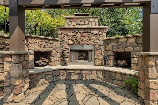 2255 Chelmsford Ln, Saint Cloud, MN 56301 - view of patio with an outdoor stone fireplace