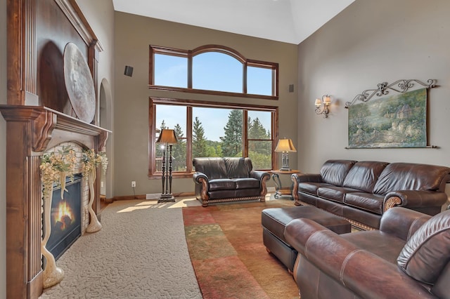 2255 Chelmsford Ln, Saint Cloud, MN 56301 - carpeted living room with a high ceiling, a high end fireplace, and baseboards