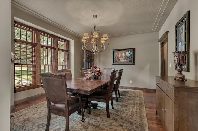 2255 Chelmsford Ln, Saint Cloud, MN 56301 - dining area with a textured ceiling, a chandelier, plenty of natural light, and dark wood-type flooring