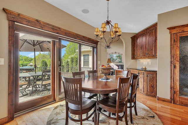 2255 Chelmsford Ln, Saint Cloud, MN 56301 - dining area with light wood-type flooring and a chandelier