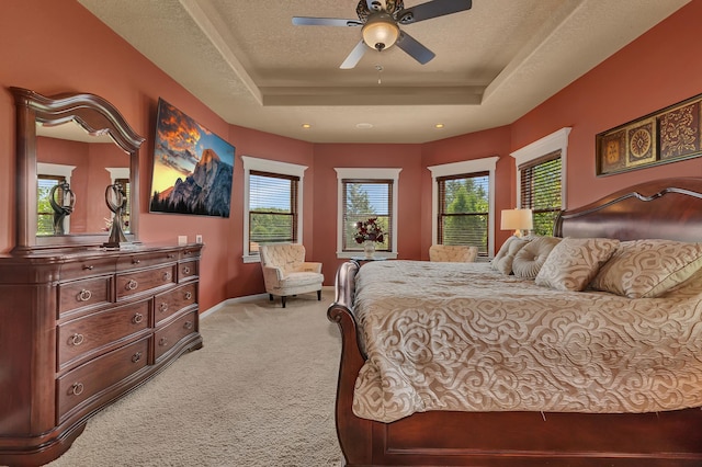2255 Chelmsford Ln, Saint Cloud, MN 56301 - bedroom featuring light colored carpet, a tray ceiling, baseboards, and a ceiling fan