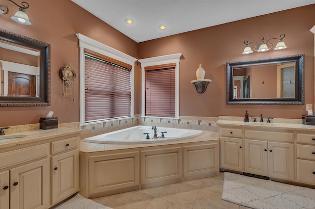 2255 Chelmsford Ln, Saint Cloud, MN 56301 - bathroom featuring vanity, tile patterned floors, and a bathtub