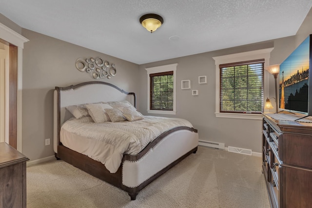 2255 Chelmsford Ln, Saint Cloud, MN 56301 - bedroom with baseboard heating, light carpet, baseboards, and a textured ceiling