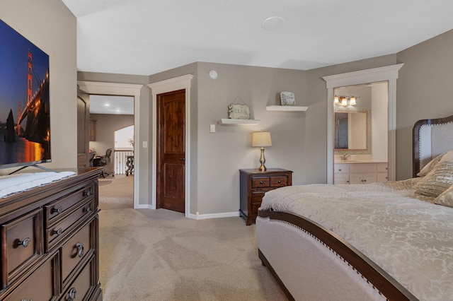 2255 Chelmsford Ln, Saint Cloud, MN 56301 - bedroom with light colored carpet, baseboards, and connected bathroom