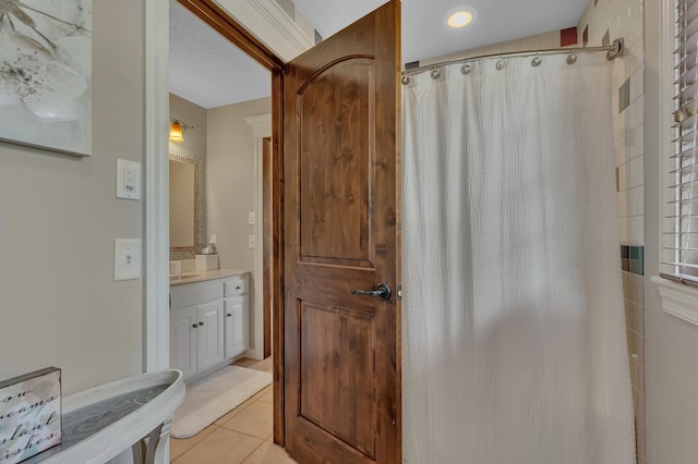 2255 Chelmsford Ln, Saint Cloud, MN 56301 - full bathroom featuring vanity, tile patterned flooring, and a shower with curtain
