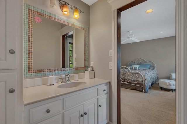 2255 Chelmsford Ln, Saint Cloud, MN 56301 - bathroom with ensuite bath, vanity, and ceiling fan