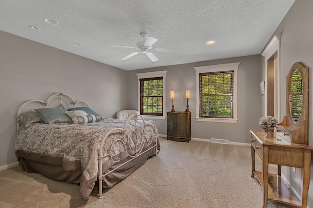 2255 Chelmsford Ln, Saint Cloud, MN 56301 - carpeted bedroom with baseboards, a textured ceiling, ceiling fan, and recessed lighting