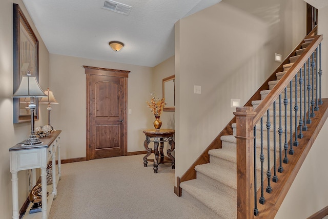 2255 Chelmsford Ln, Saint Cloud, MN 56301 - entryway featuring baseboards, stairs, and carpet floors
