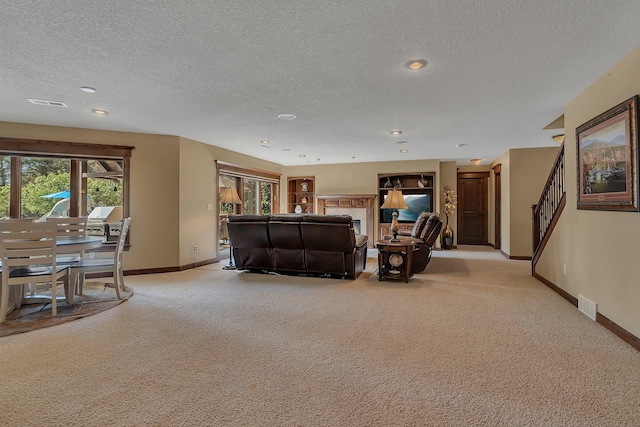 2255 Chelmsford Ln, Saint Cloud, MN 56301 - living area featuring light colored carpet, baseboards, a textured ceiling, plenty of natural light, and recessed lighting