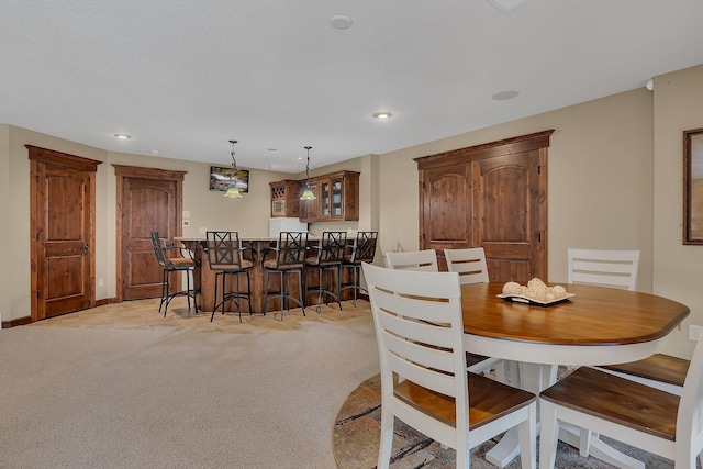 2255 Chelmsford Ln, Saint Cloud, MN 56301 - dining room with a dry bar, light carpet, and recessed lighting