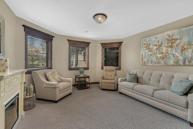 2255 Chelmsford Ln, Saint Cloud, MN 56301 - living area with light colored carpet, a fireplace, baseboards, and a textured ceiling