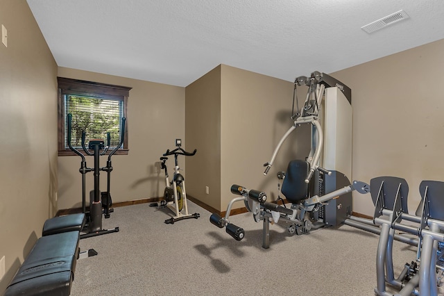 2255 Chelmsford Ln, Saint Cloud, MN 56301 - workout room featuring baseboards and a textured ceiling