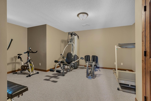 2255 Chelmsford Ln, Saint Cloud, MN 56301 - exercise room featuring baseboards and a textured ceiling