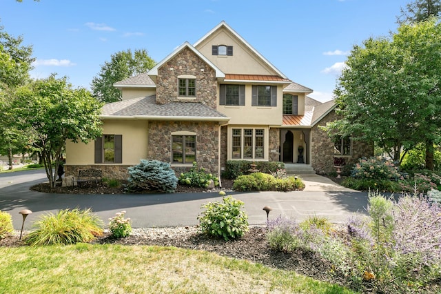 2255 Chelmsford Ln, Saint Cloud, MN 56301 - traditional-style home with stone siding, stucco siding, a standing seam roof, and metal roof