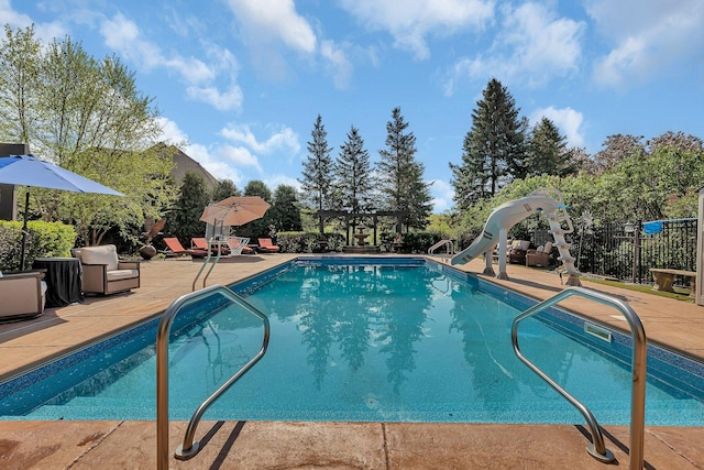 2255 Chelmsford Ln, Saint Cloud, MN 56301 - view of pool with a water slide, a pergola, and a patio