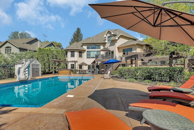 2255 Chelmsford Ln, Saint Cloud, MN 56301 - view of pool featuring a water slide, a patio area, and a residential view