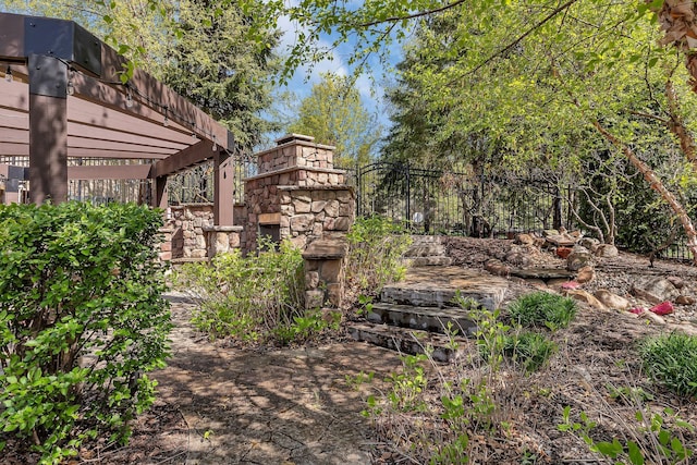 2255 Chelmsford Ln, Saint Cloud, MN 56301 - view of yard with a fireplace and a pergola