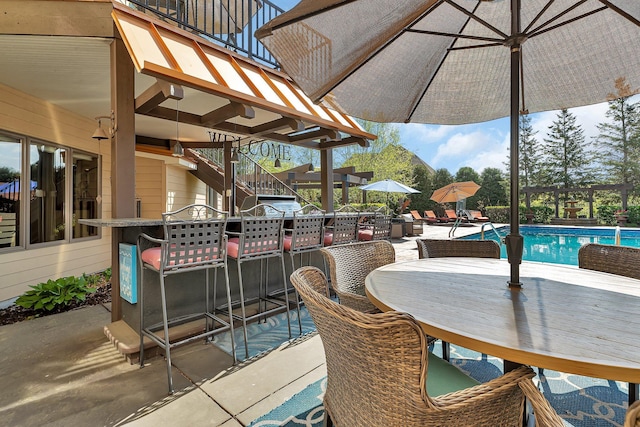 2255 Chelmsford Ln, Saint Cloud, MN 56301 - view of patio / terrace featuring stairway, an outdoor pool, and outdoor dining area
