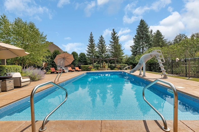 2255 Chelmsford Ln, Saint Cloud, MN 56301 - view of pool featuring a pergola, a water slide, and a patio area
