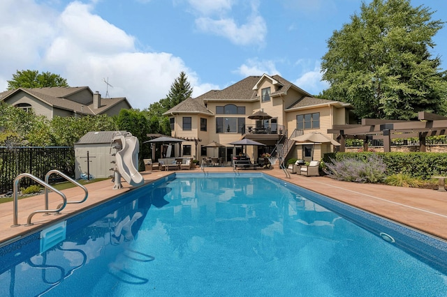 2255 Chelmsford Ln, Saint Cloud, MN 56301 - view of swimming pool featuring a water slide and a patio