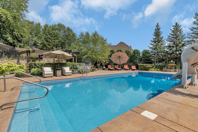 2255 Chelmsford Ln, Saint Cloud, MN 56301 - outdoor pool with a water slide, a pergola, and a patio area