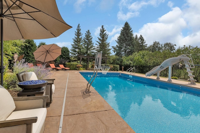 2255 Chelmsford Ln, Saint Cloud, MN 56301 - view of swimming pool with a water slide and a patio area