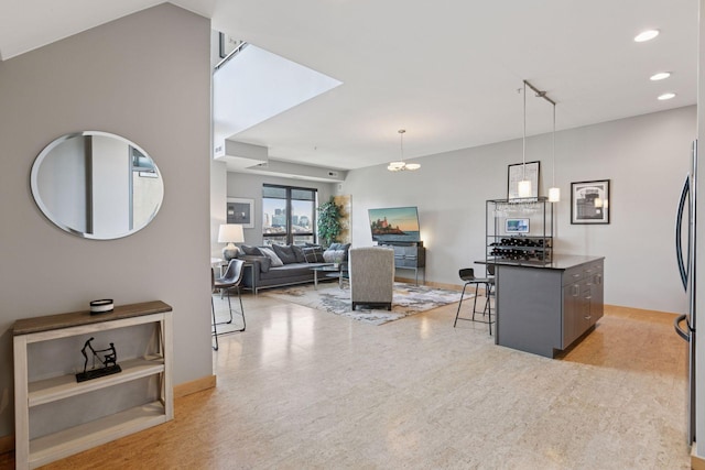 dining area featuring recessed lighting and baseboards
