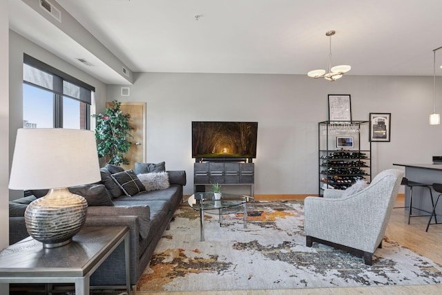 living area featuring baseboards and wood finished floors