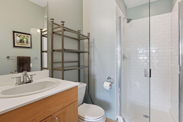 full bath with toilet, a shower stall, and vanity