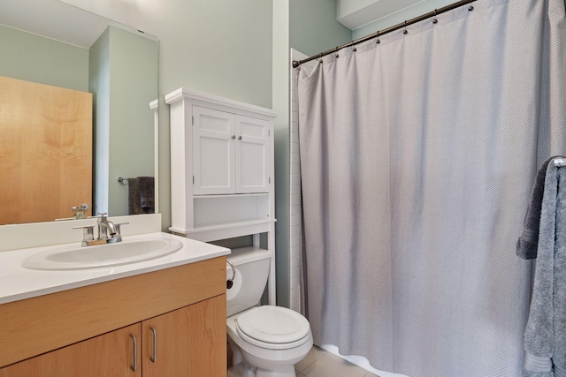 bathroom featuring vanity, toilet, and curtained shower
