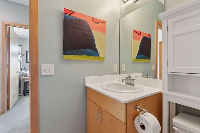 bathroom with vanity and toilet