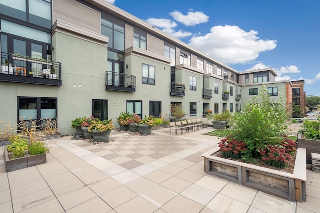 surrounding community with a patio area