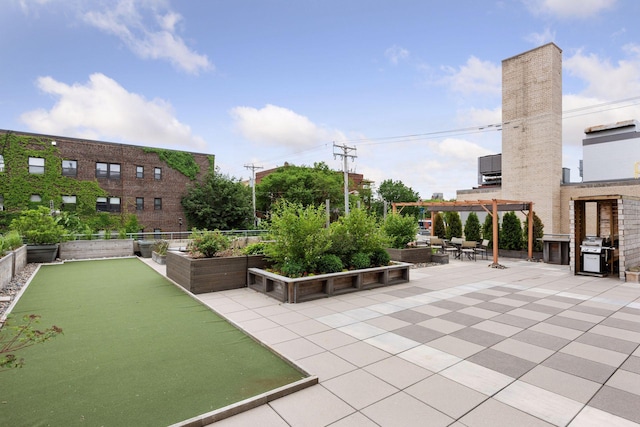 view of community featuring a pergola, a bocce ball area, and a patio area