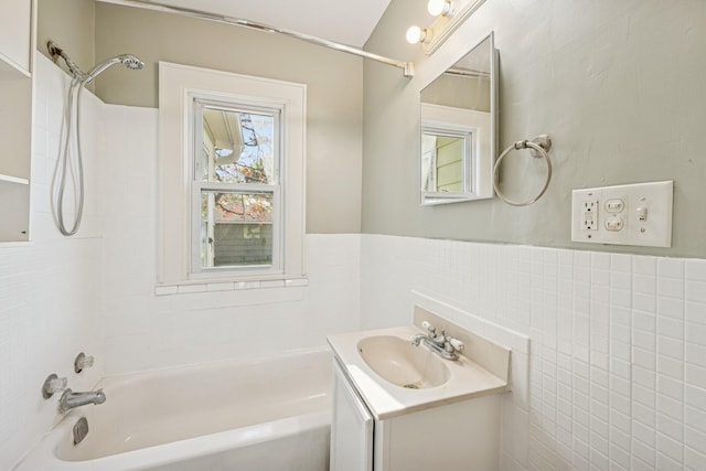 2647 Abbott Ave N, Robbinsdale, MN 55422 - full bath featuring bathing tub / shower combination, tile walls, vanity, and wainscoting