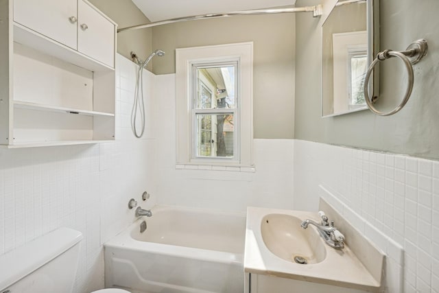 2647 Abbott Ave N, Robbinsdale, MN 55422 - bathroom with tile walls, toilet, shower / bath combination, and vanity
