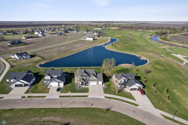 aerial perspective of suburban area with a large body of water