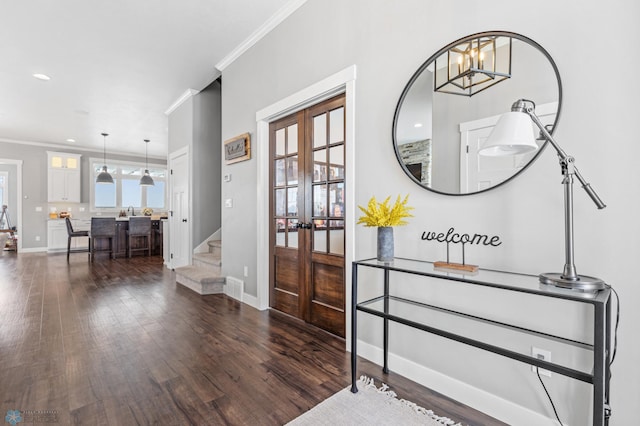 entryway with french doors, crown molding, dark wood-style floors, baseboards, and stairway