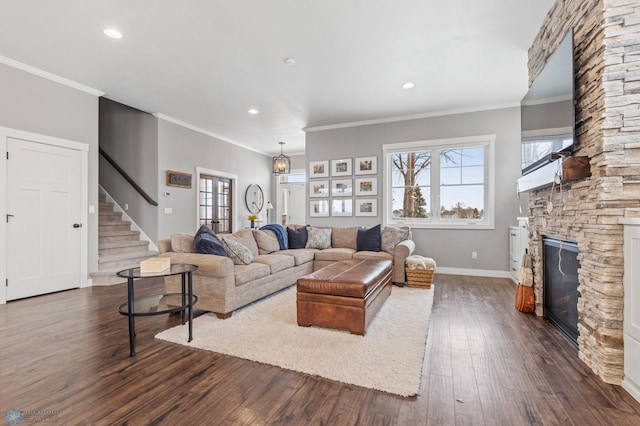 living area with dark wood finished floors, a fireplace, stairs, baseboards, and recessed lighting