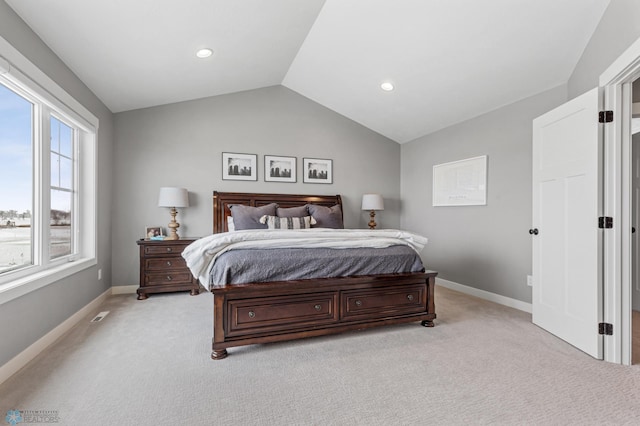 bedroom featuring light colored carpet, vaulted ceiling, baseboards, and recessed lighting