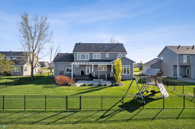 back of property featuring a patio, a playground, and a shingled roof