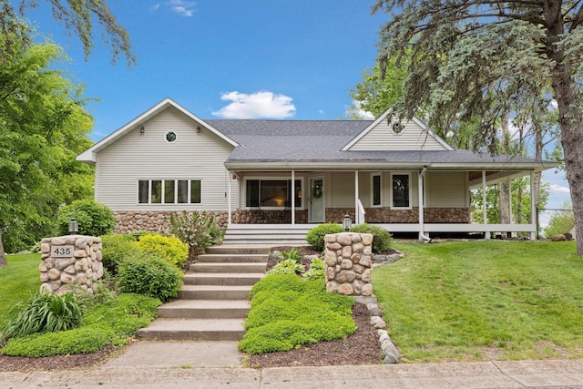 435 Burlington Rd, Saint Paul, MN 55119 - view of front facade with stone siding, a front lawn, covered porch, and a shingled roof