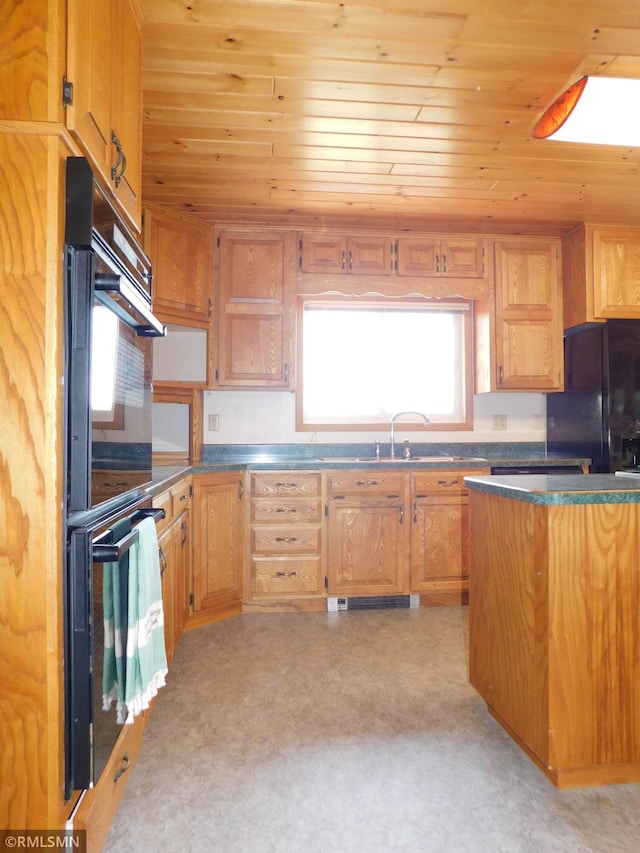 32598 Pioneer Ave, Aitkin, MN 56431 - kitchen featuring black appliances, wooden ceiling, dark countertops, and a sink