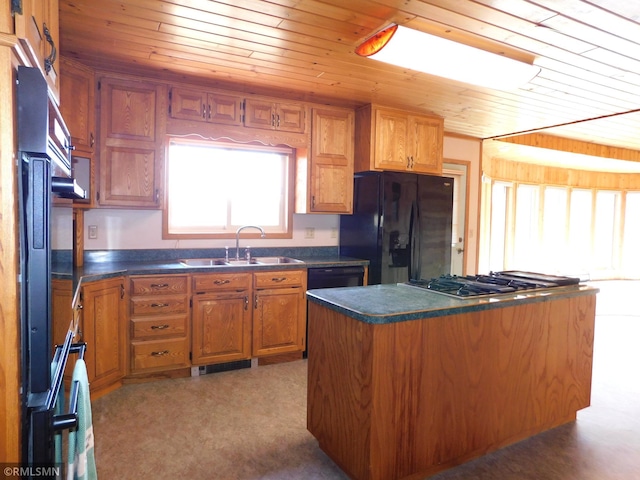32598 Pioneer Ave, Aitkin, MN 56431 - kitchen with a sink, black fridge, wood ceiling, dark countertops, and stainless steel gas cooktop
