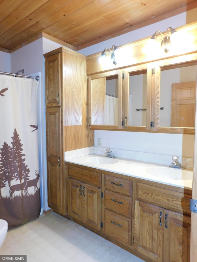 32598 Pioneer Ave, Aitkin, MN 56431 - bathroom featuring wooden ceiling, double vanity, and a shower with curtain