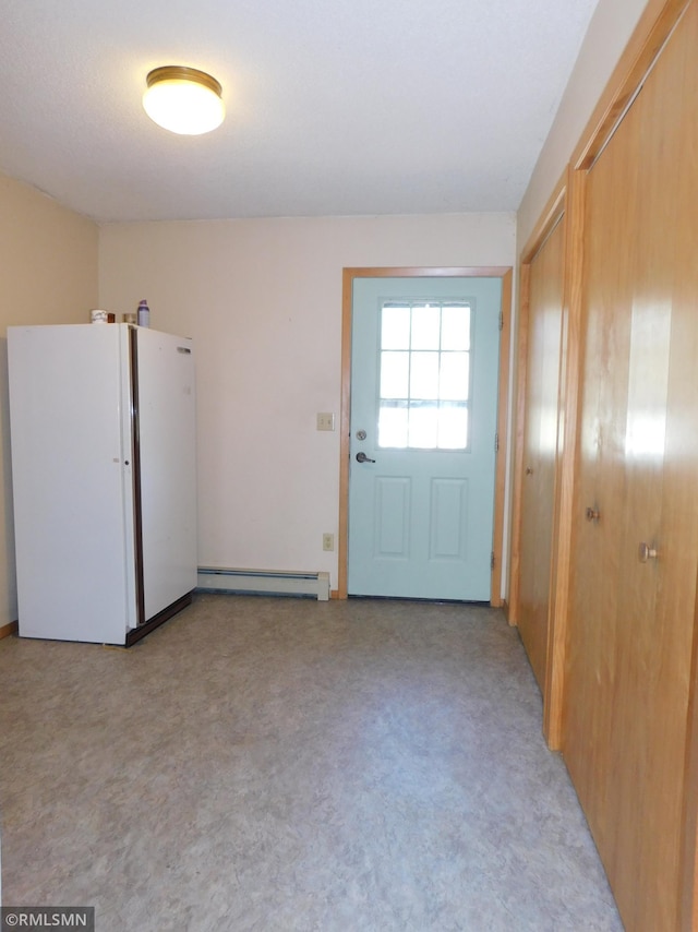 32598 Pioneer Ave, Aitkin, MN 56431 - doorway with a baseboard heating unit and light colored carpet