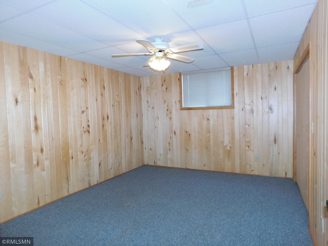32598 Pioneer Ave, Aitkin, MN 56431 - carpeted empty room featuring a drop ceiling and wood walls