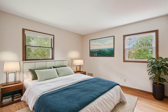 3529 Jerry St, White Bear Lake, MN 55110 - bedroom with light wood-style floors and baseboards